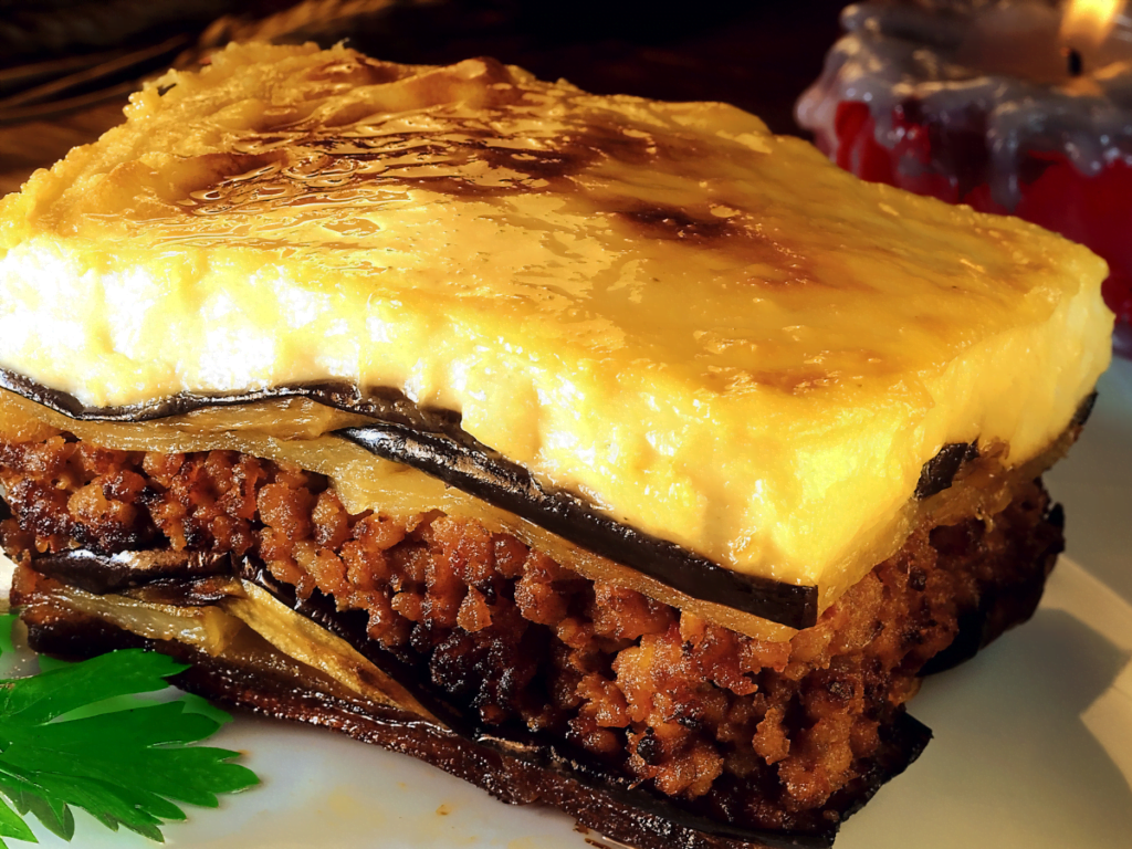 Traditional Greek moussaka with eggplant, seasoned meat, and béchamel sauce