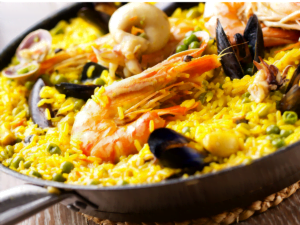 Traditional Spanish paella with saffron rice, seafood, meats, and vegetables