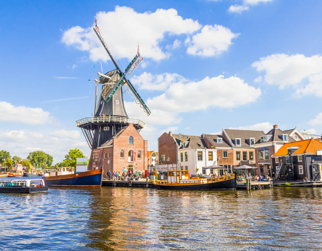 Iconic Dutch windmill by the water, symbolizing the Netherlands' rich cultural heritage and scenic beauty