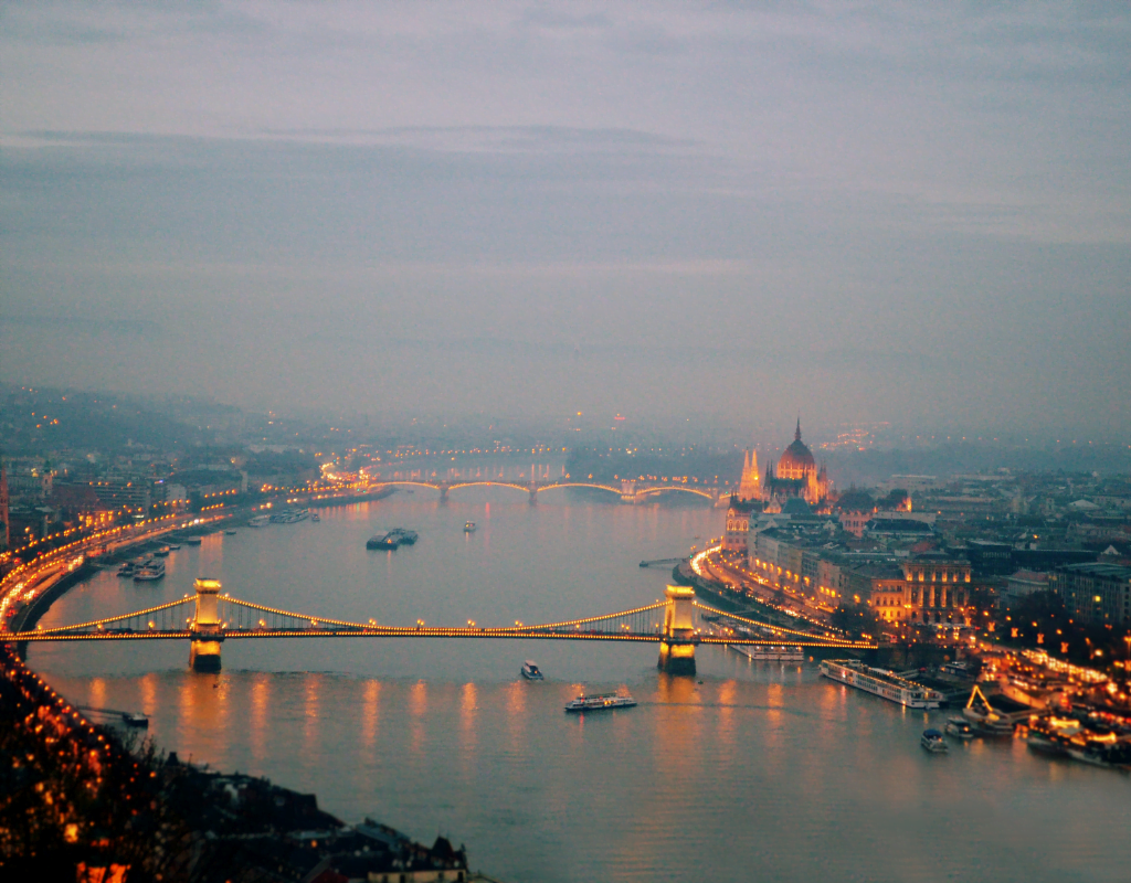 Budapest at evening, showcasing the iconic bridge and cityscape along the Danube River, reflecting Hungary's cultural beauty