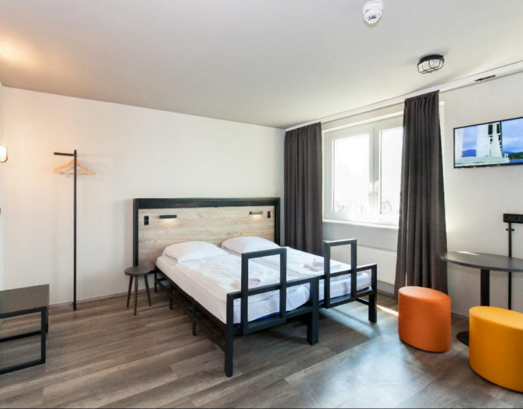 Cozy room at A&O Berlin Mitte with modern amenities.