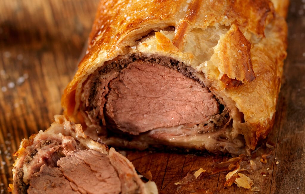 Classic Beef Wellington with tender beef fillet, mushroom duxelles, and puff pastry