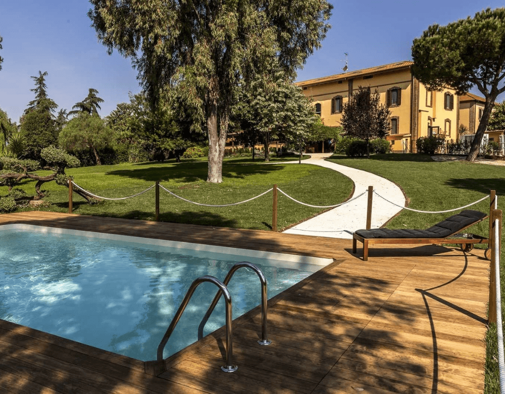 BoMa Country House surrounded by the lush greenery of Tenuta Naturale della Marcigliana in Rome.