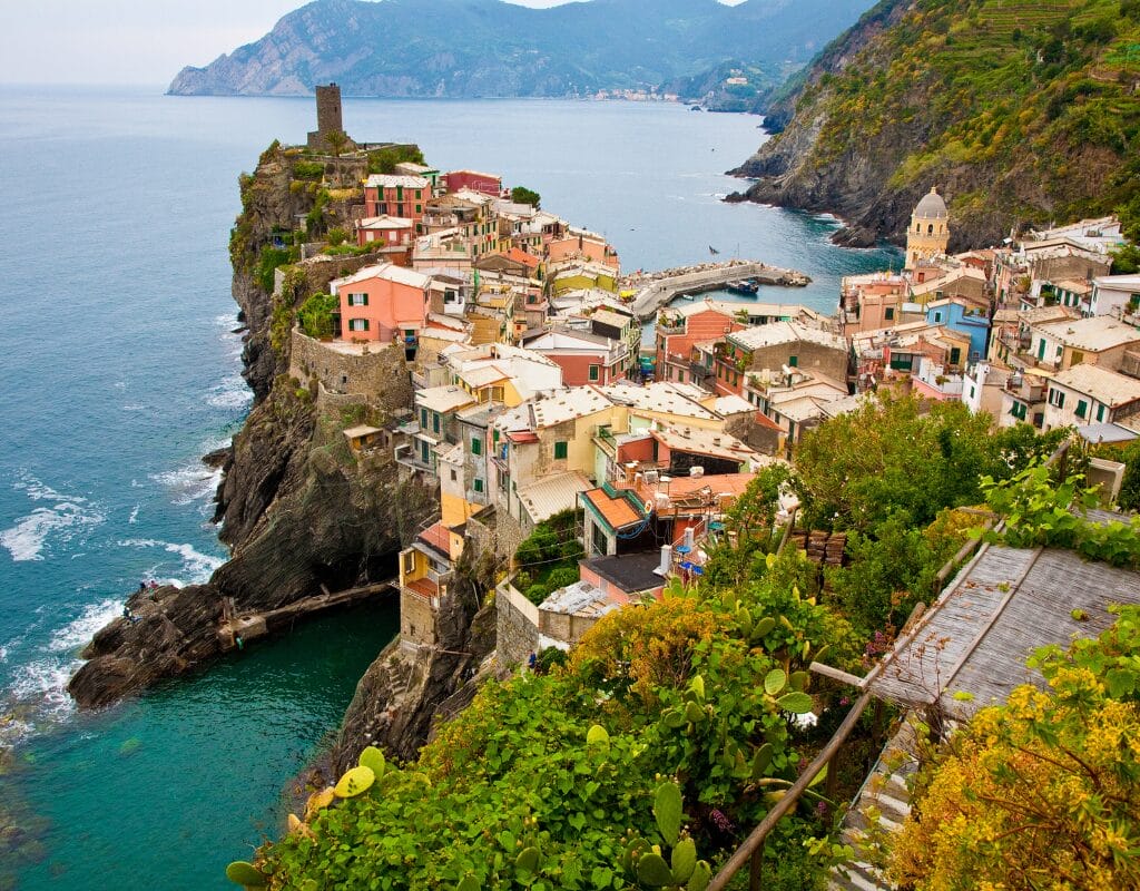 A vibrant village in Cinque Terre perched on cliffs above the Mediterranean Sea