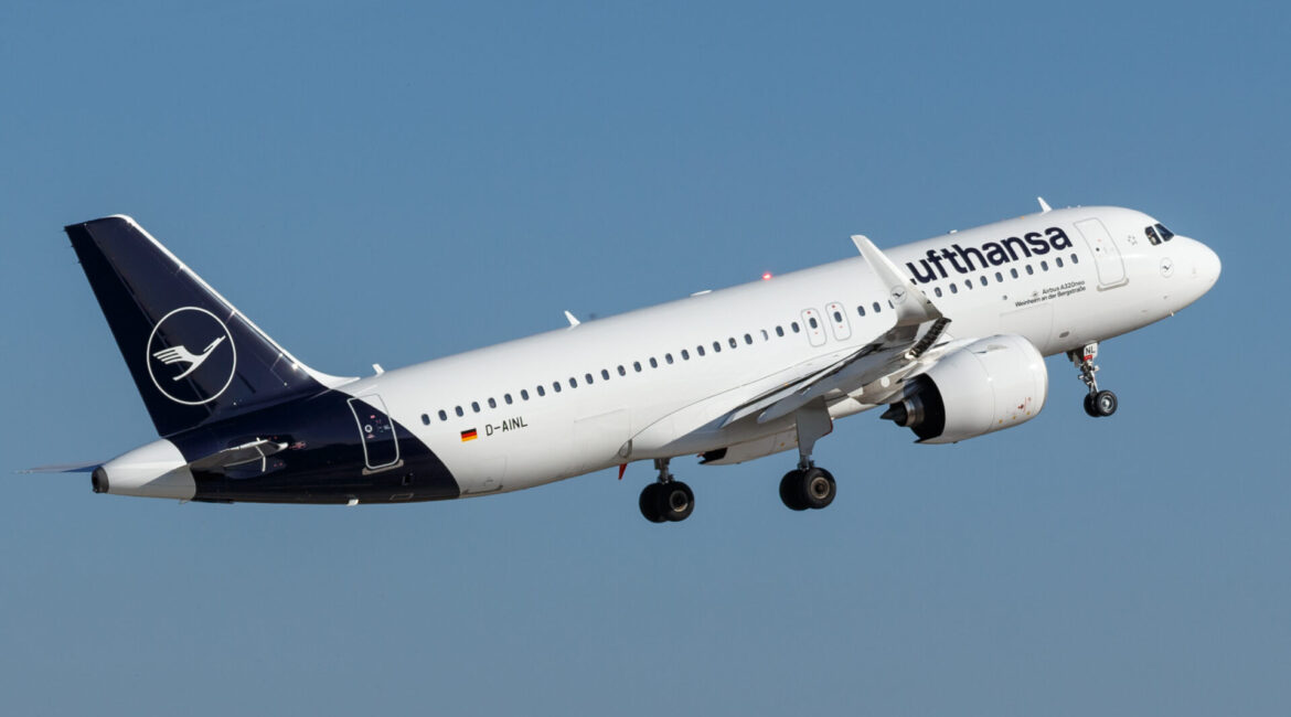 Lufthansa airplane on the runway, preparing for takeoff, showcasing the airline's distinctive blue and yellow livery.