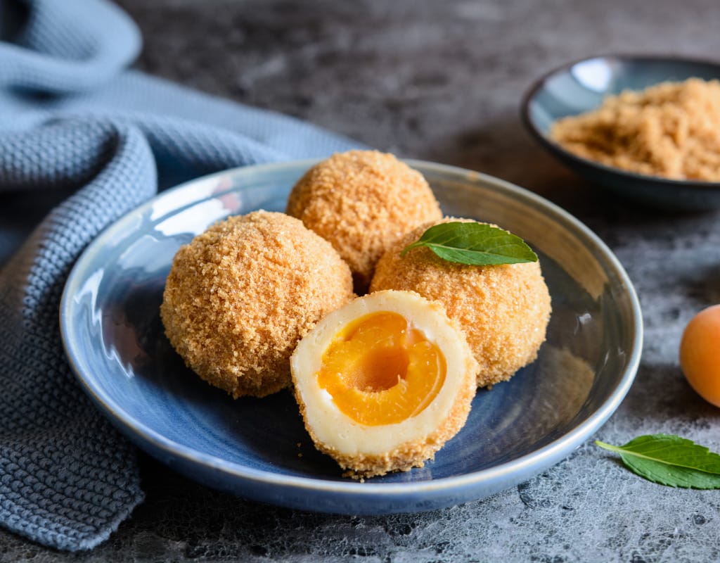 Traditional Austrian apricot dumplings with powdered sugar