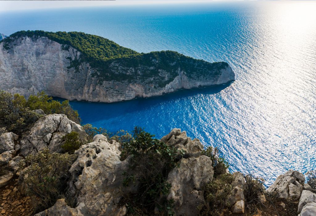 Sunlit crystal-clear turquoise sea at Navagio Beach, Zakynthos, Greece