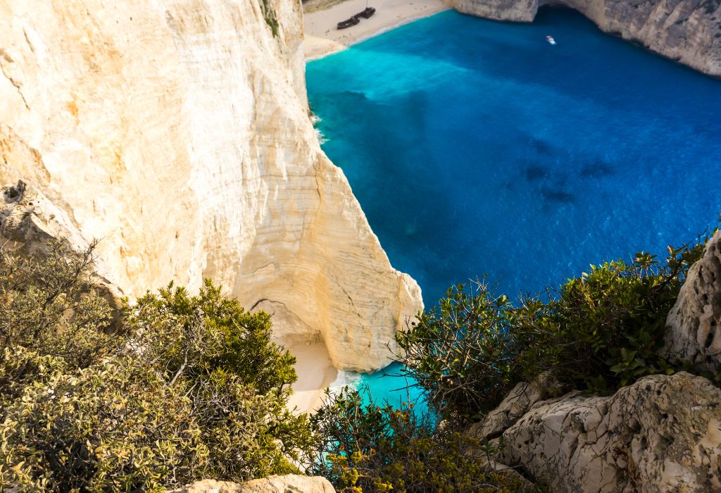 Bright cliffs and turquoise sea at Navagio Beach, Zakynthos, Greece