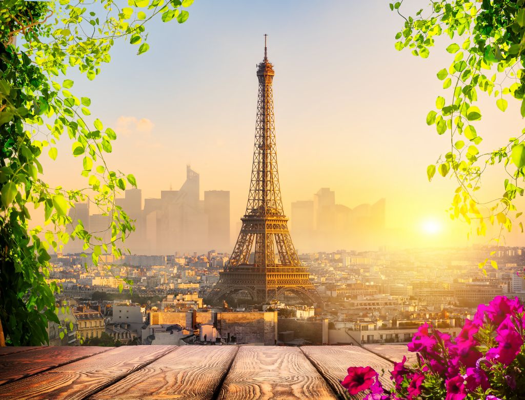 Eiffel Tower silhouette against a setting sun in Paris, France