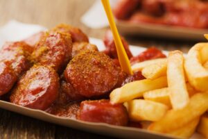 Authentic German currywurst with sausages and curry ketchup sauce