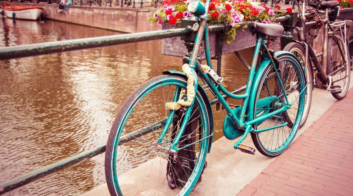 Old bicycle by a canal in the Netherlands