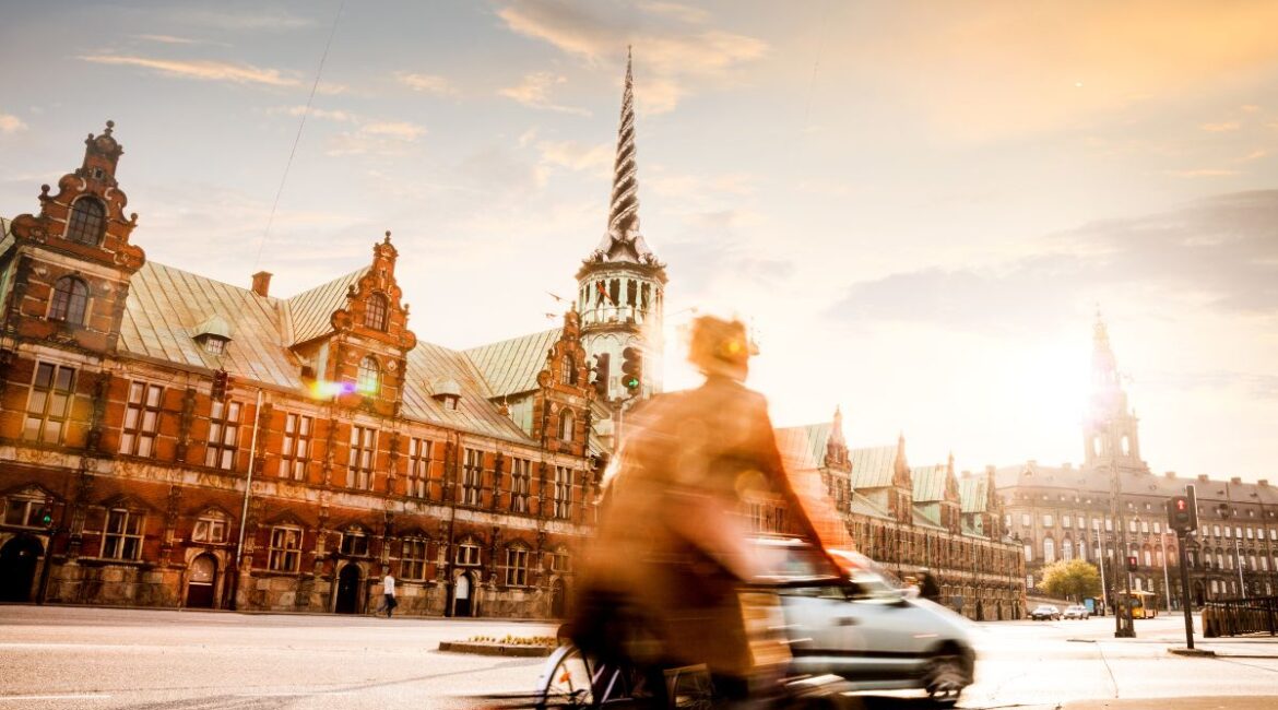 Cyclist riding through the streets of Copenhagen.