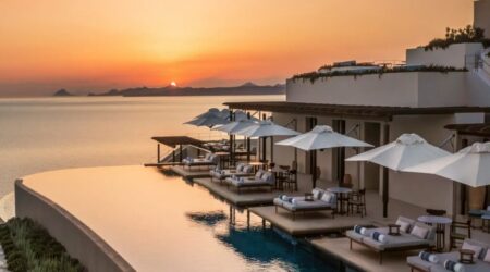 Terrace of One&Only Kéa Island at sunset, overlooking the Aegean Sea with a warm, golden glow.