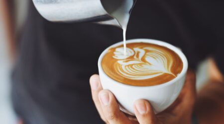 A steaming cup of coffee in a traditional Viennese café, representing the rich coffee culture in Vienna.