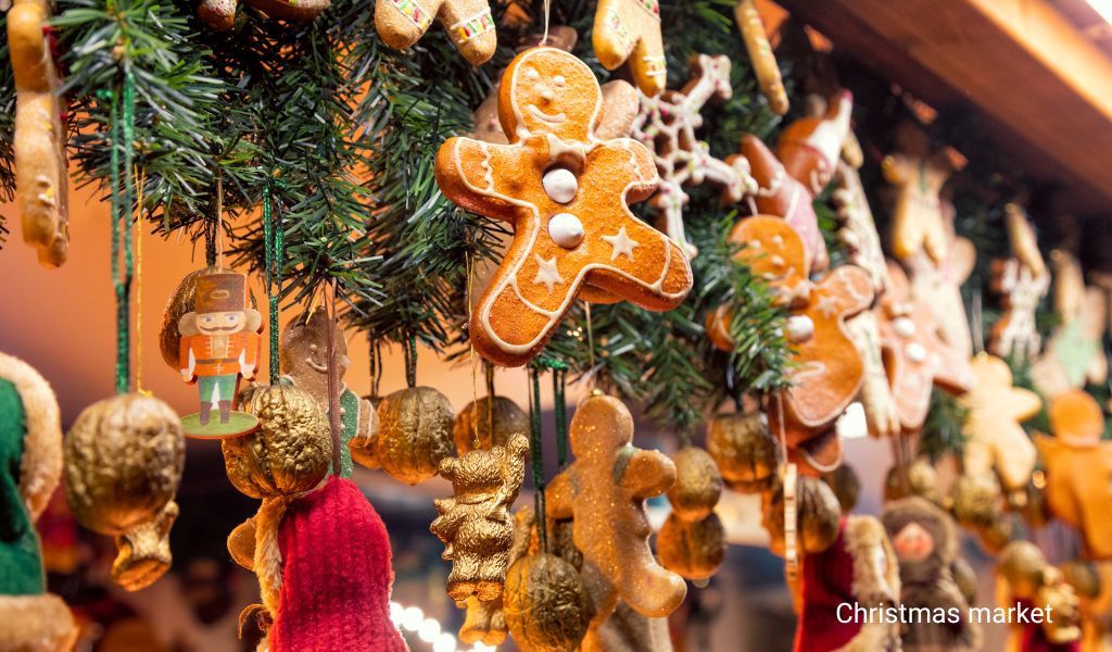 Christmas market stand in Mainz with Christmas decorations and pastries