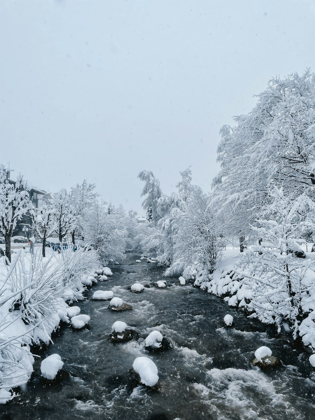 Frozen river in a winter landscape, representing the extensive ski area of Saalbach-Hinterglemm, suitable for all skill levels.