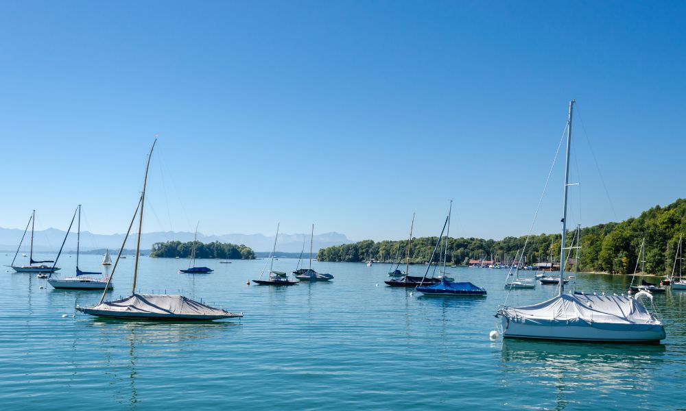 Serene view of Starnberger See with clear waters and surrounding hills in Bavaria, Germany